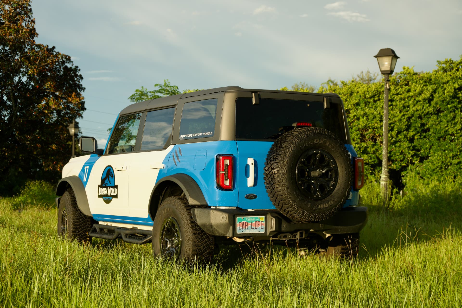 Rear three quarter view showing claw mark decals and spare tire carrier